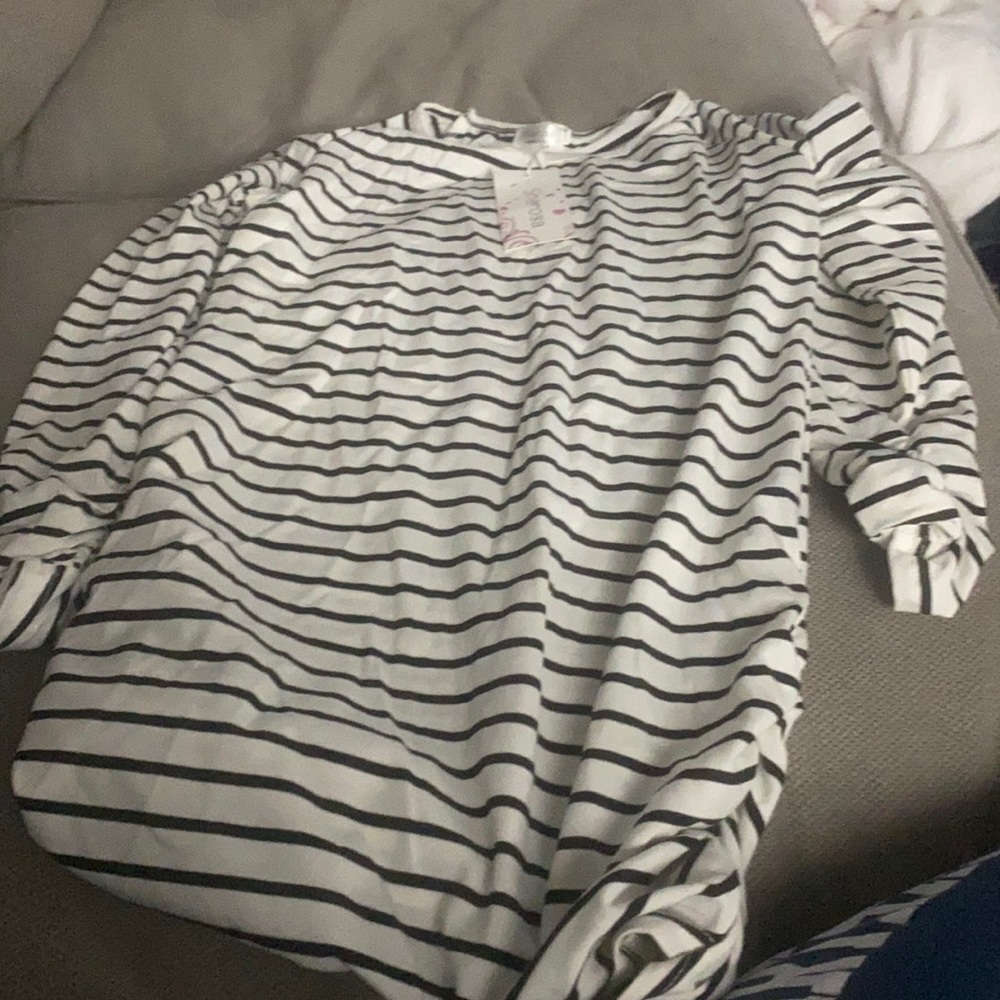 Black and white striped women’s shirt with gathering on sides